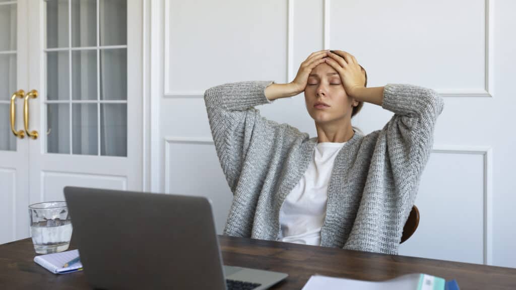medium shot worried woman desk